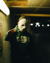 a person wearing a mask and holding a knife