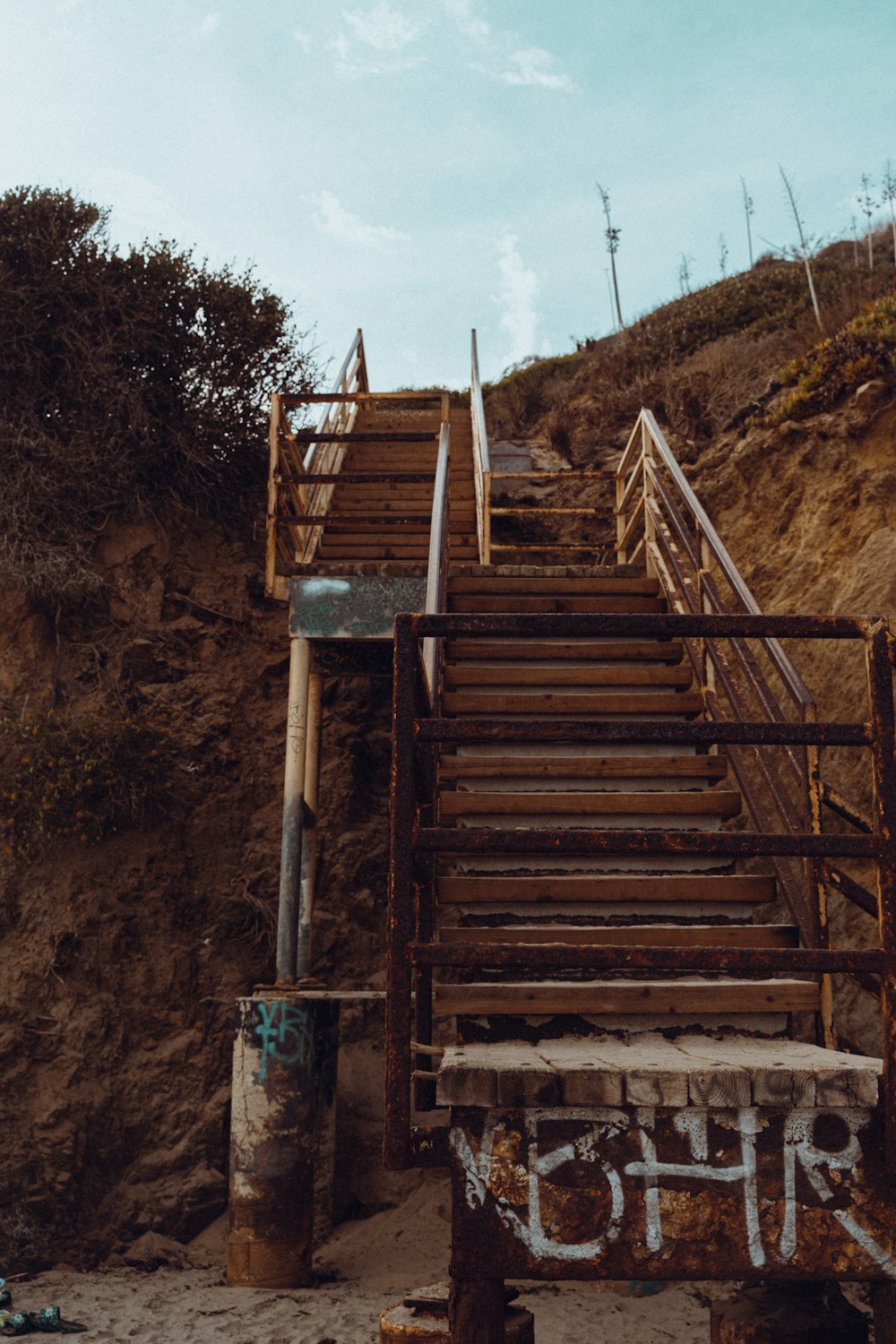 a set of stairs leading up to a cliff