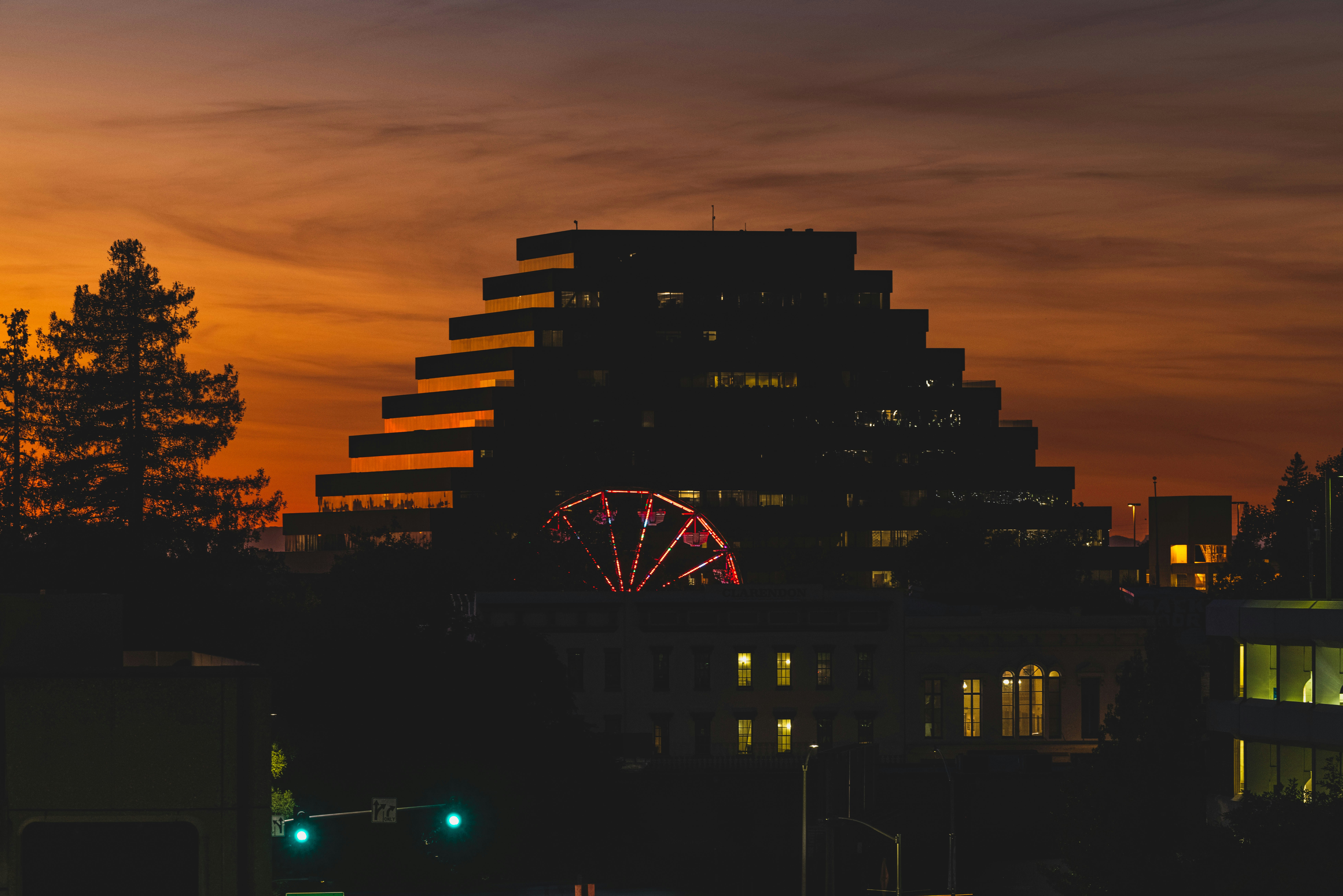 a ferris wheel in a city at night