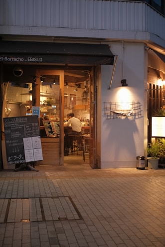 a restaurant with a sign in front of it