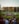 a group of people that are sitting in the grass