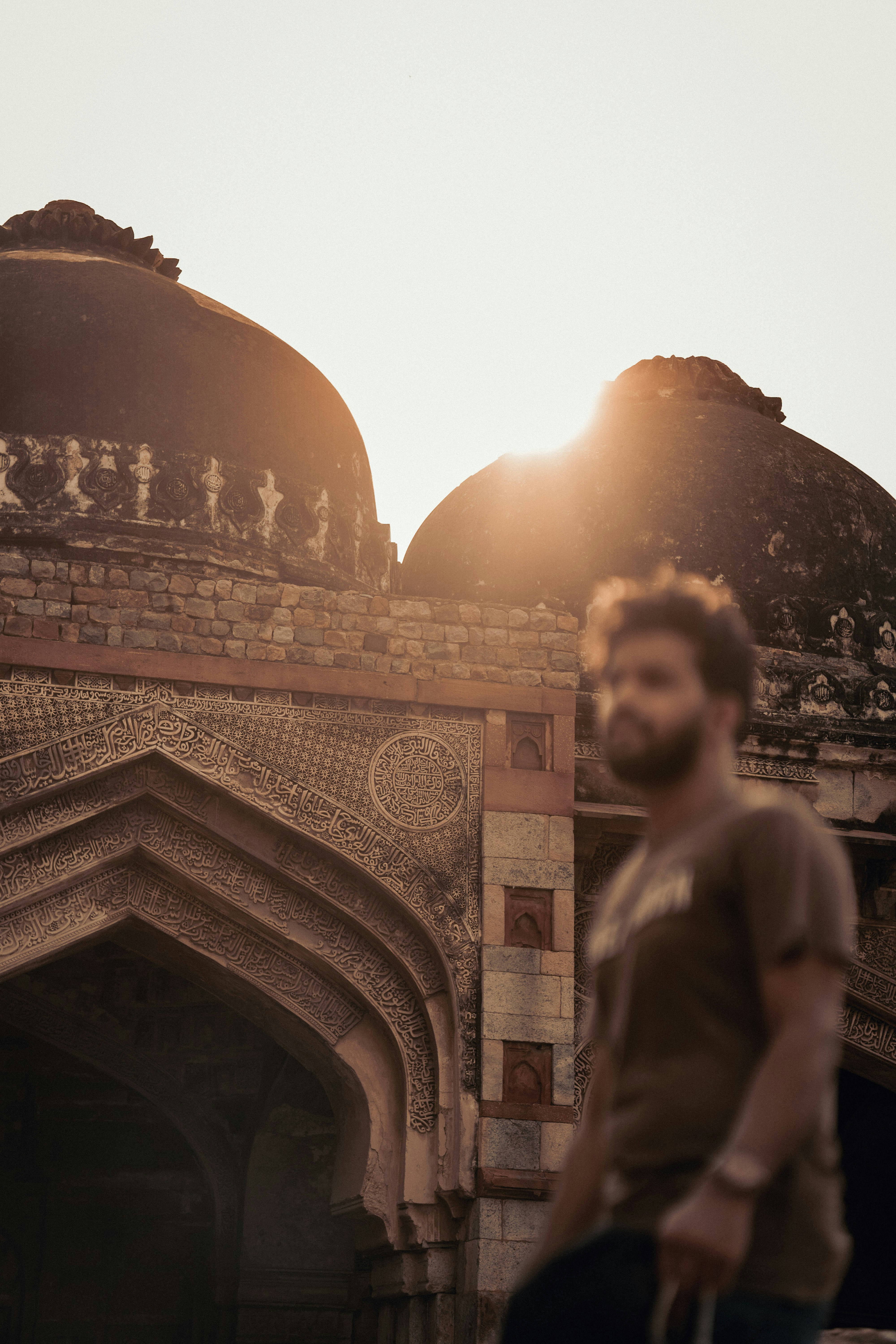 a man is standing in front of a building