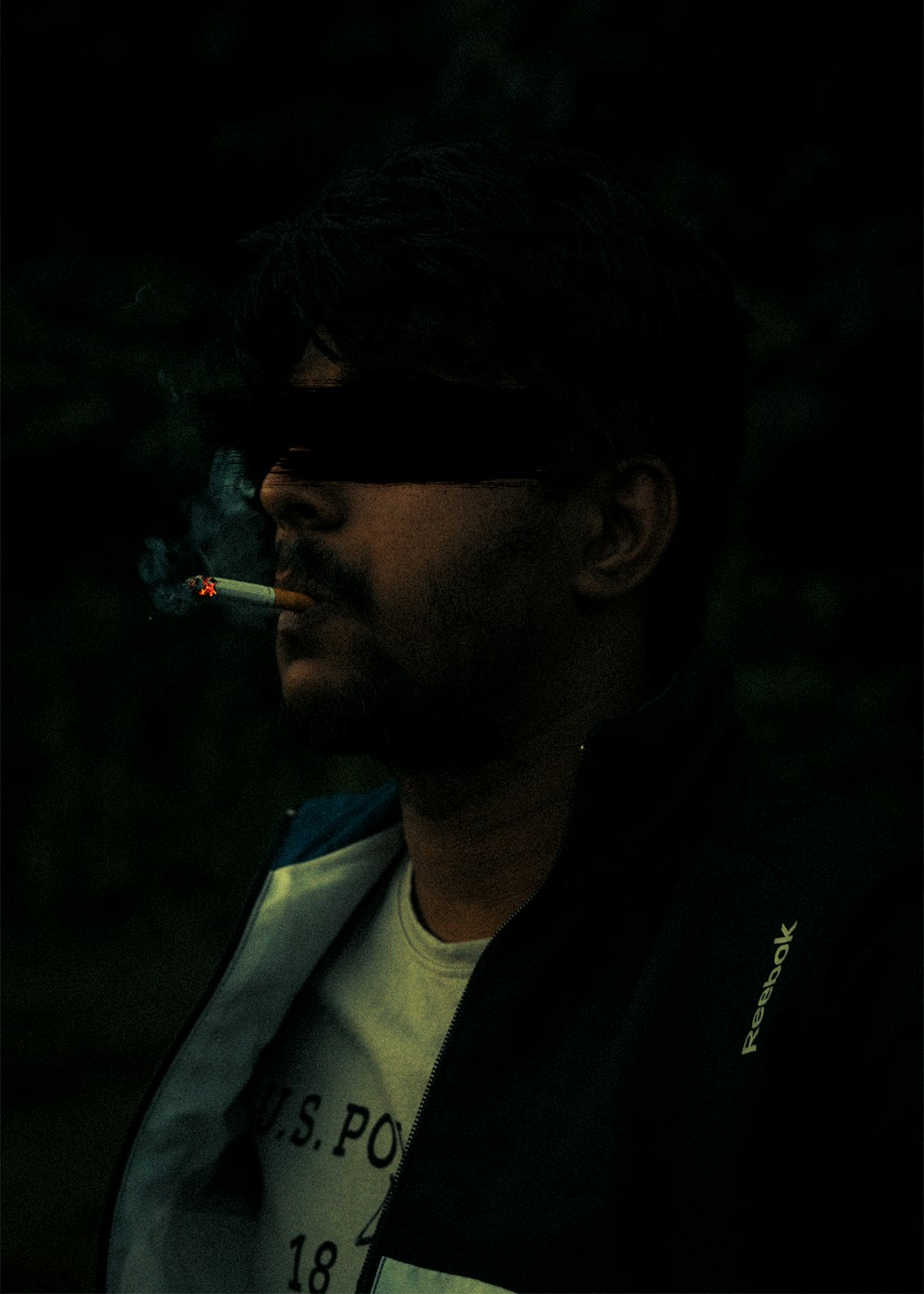 a man with a cigarette in his mouth