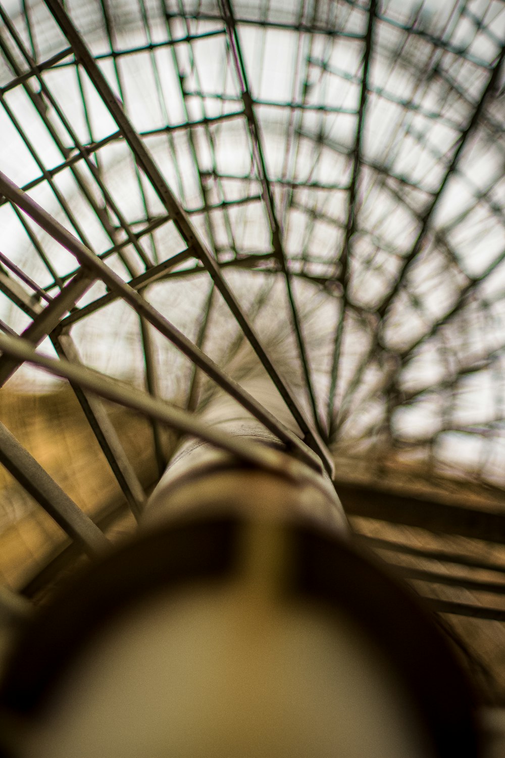 a close up of a metal structure with a sky background