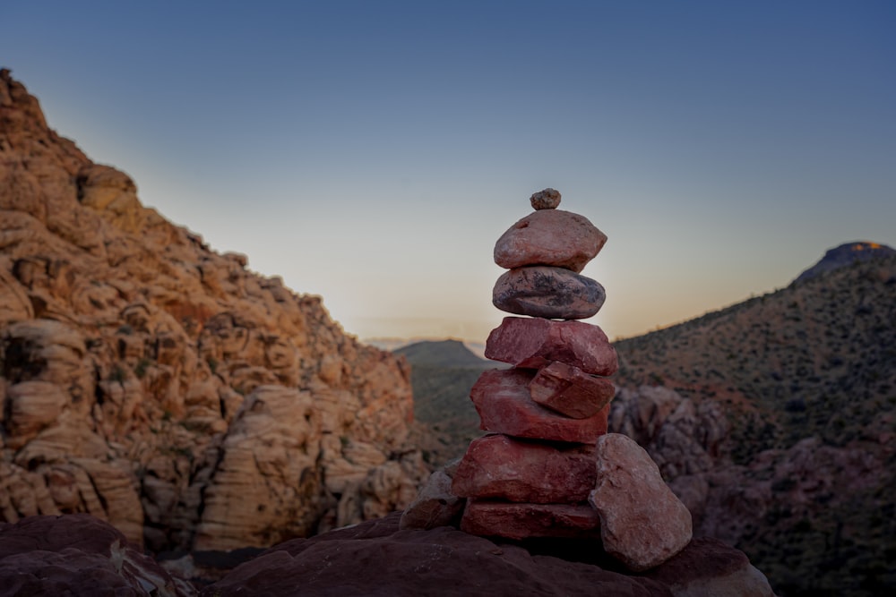 a stack of rocks sitting on top of a mountain