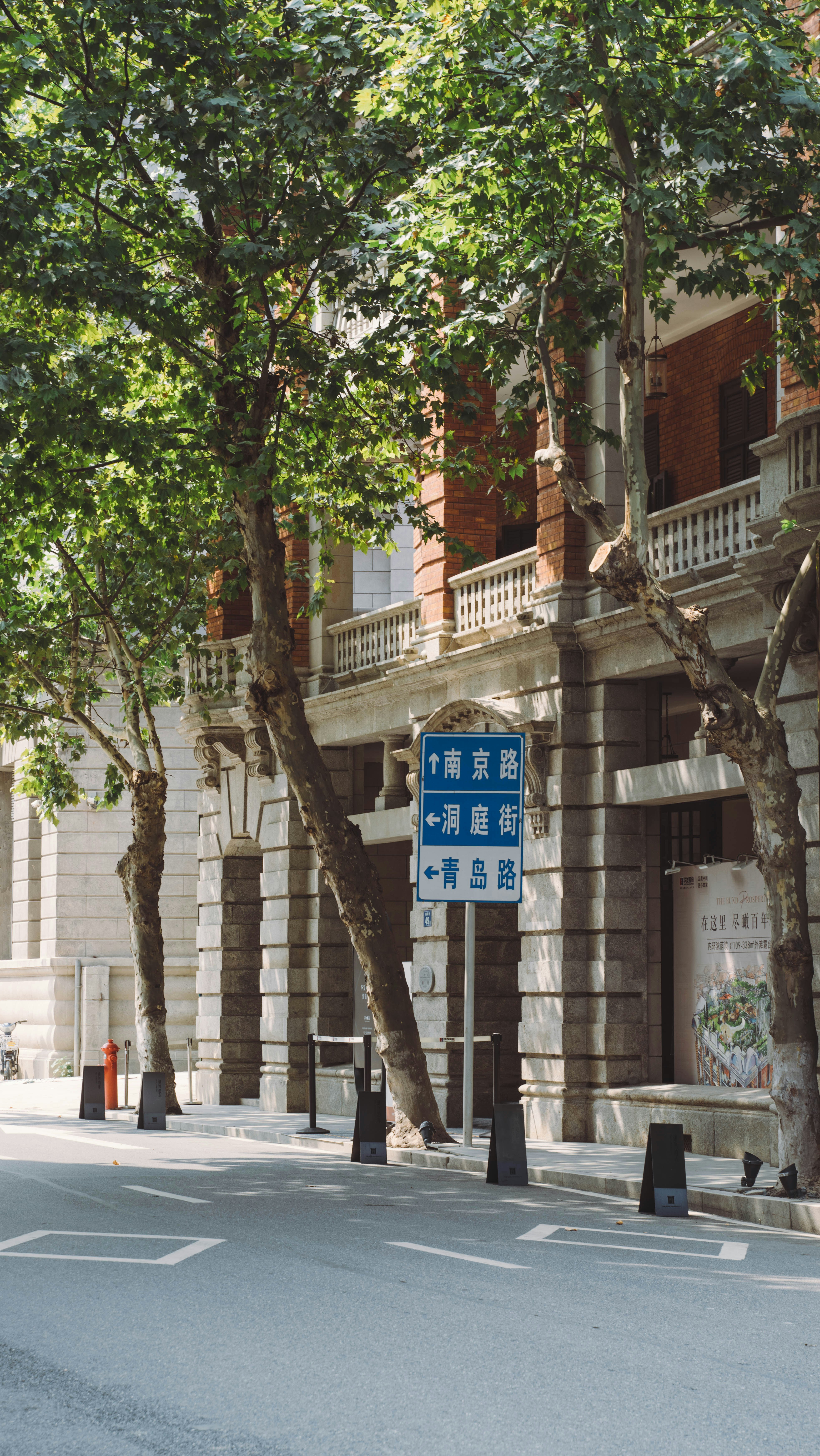 a blue street sign in front of a building