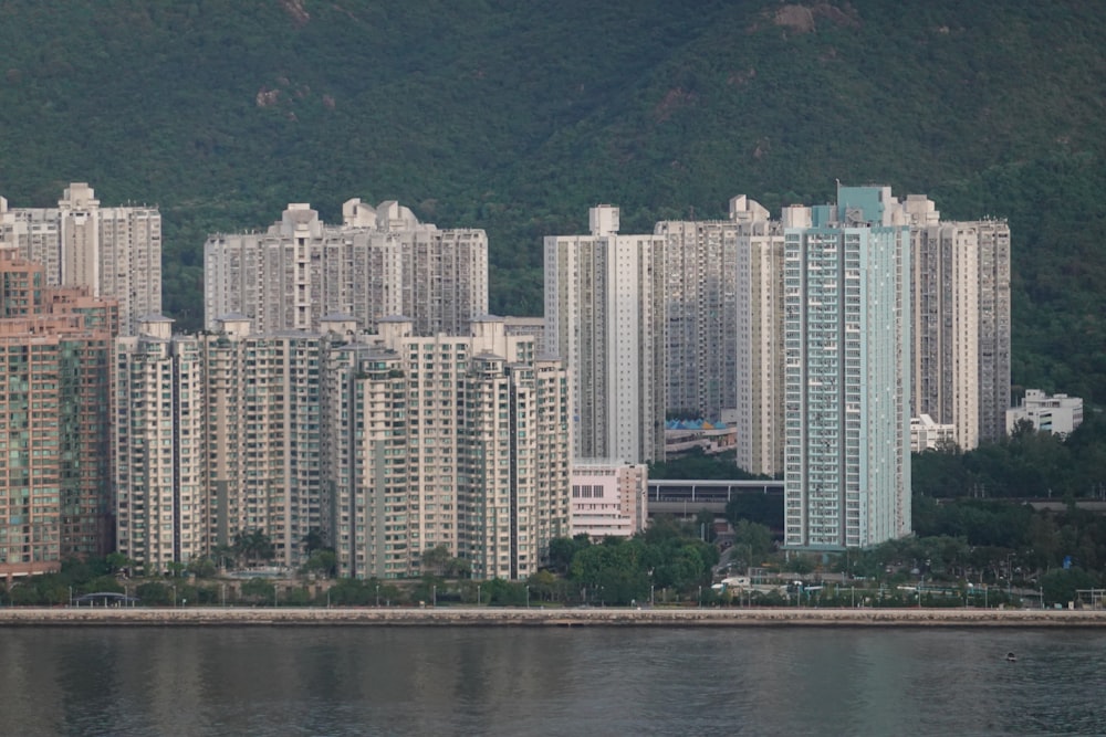 a large body of water in front of tall buildings