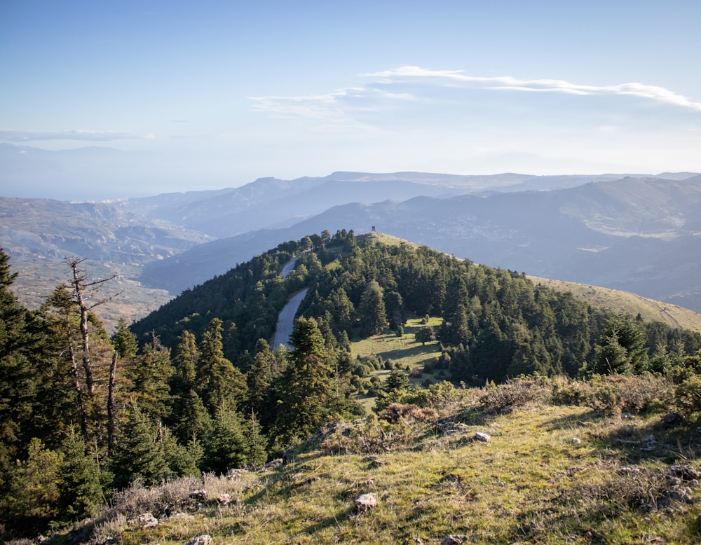 a view of a mountain with a valley in the distance