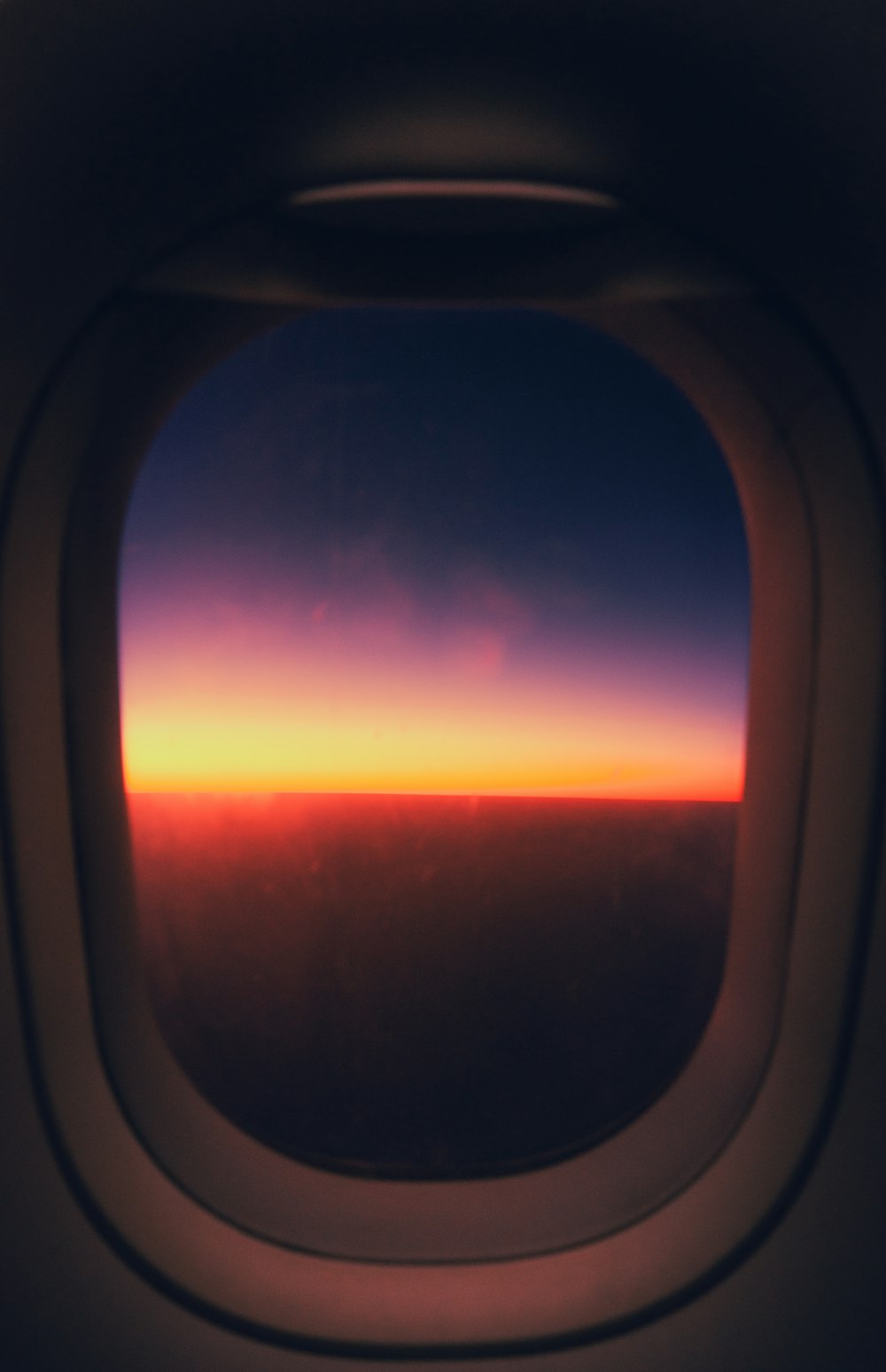 a view of the sunset from an airplane window