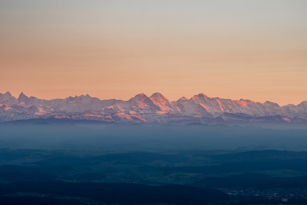 a view of a mountain range at sunset