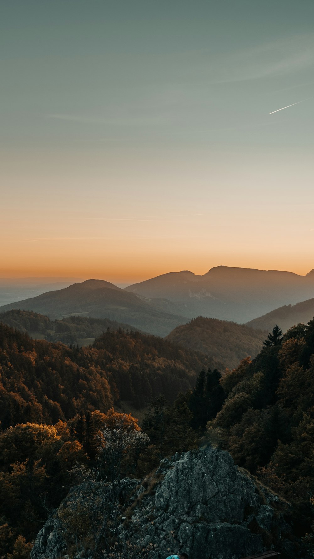 a view of a mountain range at sunset