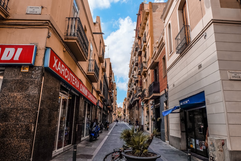 a narrow city street lined with tall buildings