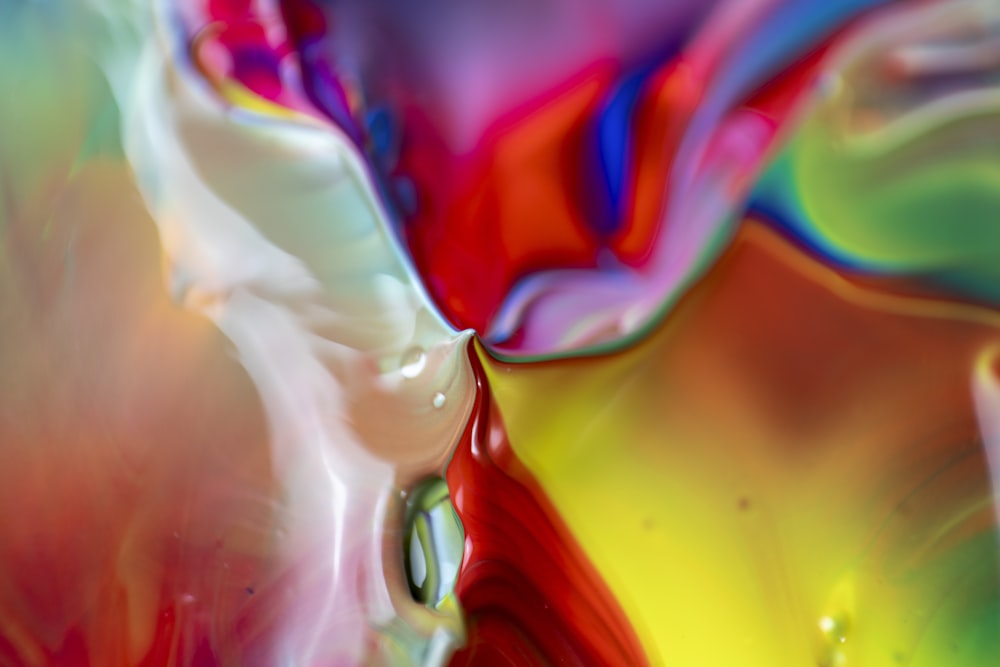 a close up view of a multicolored liquid