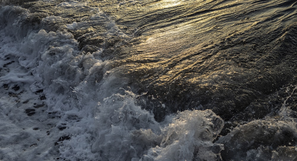 the sun shines through the clouds over the water