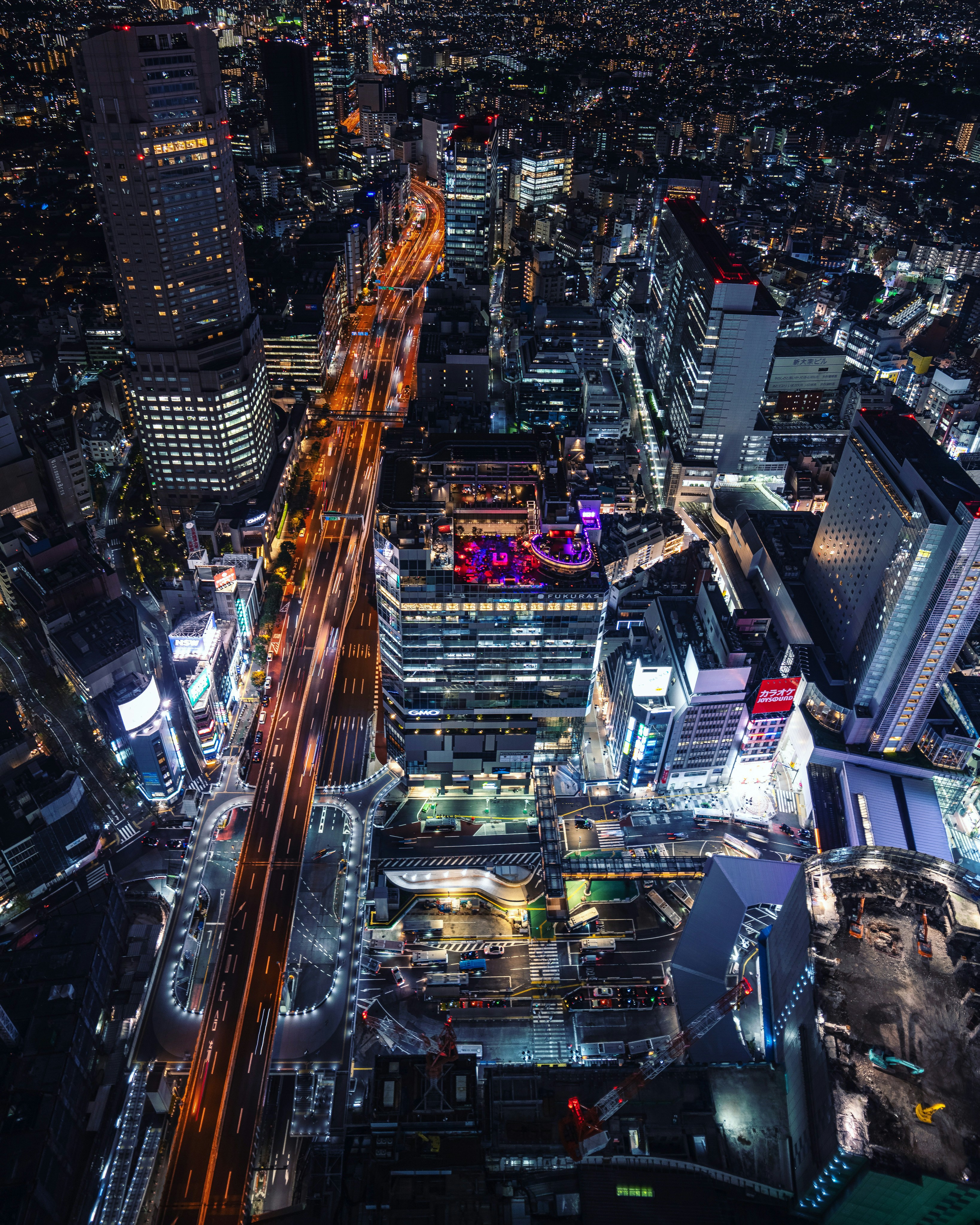 an aerial view of a city at night
