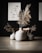 A collection of elegant ceramic vases displayed on a stylish wooden table in a bright living room.