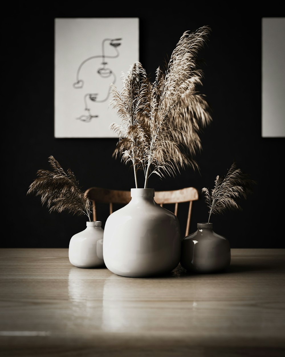 three vases with plants in them sitting on a table