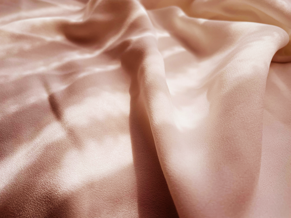 a close up of a pink satin fabric