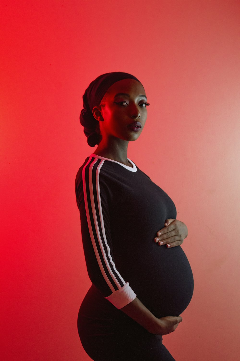 a pregnant woman in a black and white outfit