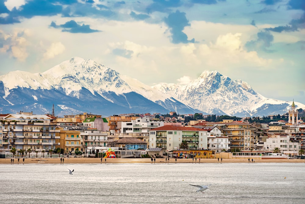 a view of a city with mountains in the background