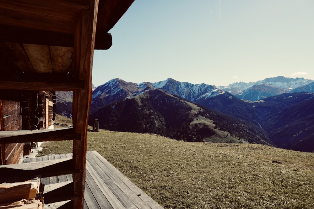 a view of a mountain range from a deck