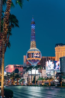 the eiffel tower in las vegas is lit up at night