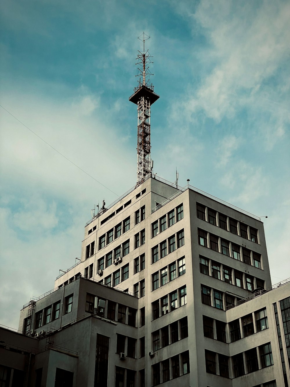 a tall building with a sky background