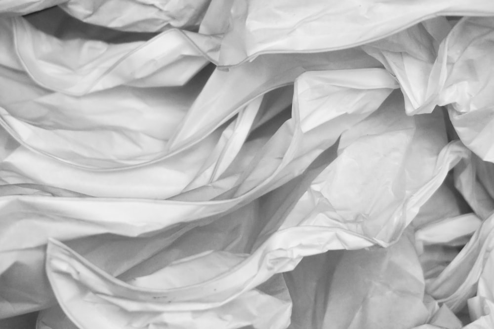 a black and white photo of wrinkled fabric