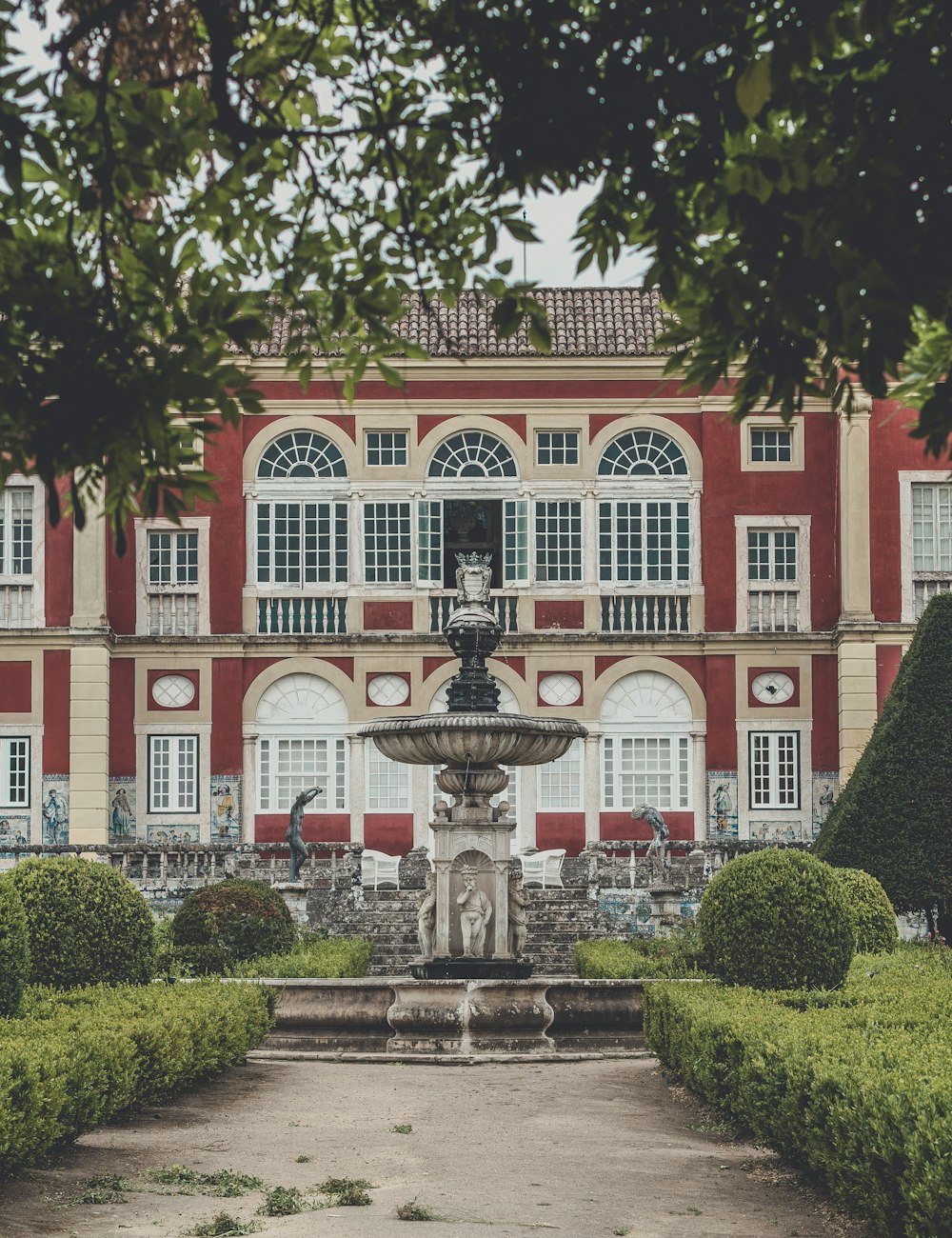 a large building with a fountain in front of it