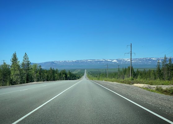 An empty road across the tundra — Murmansk, Russia
