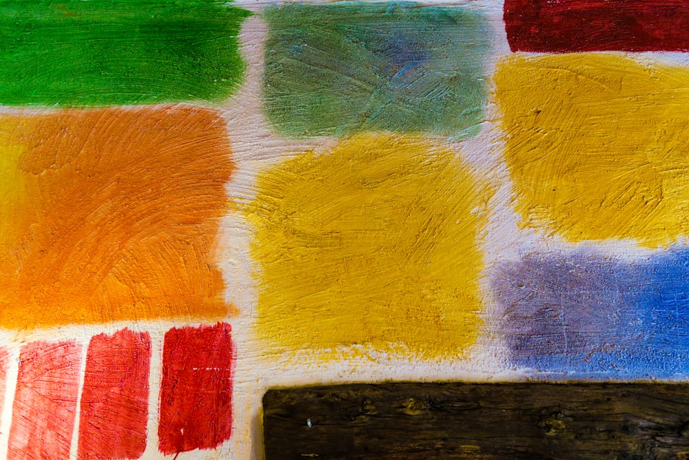 um close up de uma pintura com diferentes cores de tinta