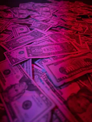 a pile of money sitting on top of a table