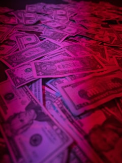 a pile of money sitting on top of a table