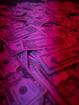 a pile of money sitting on top of a table
