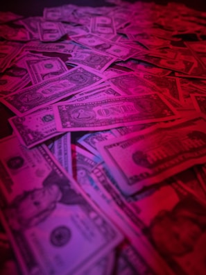 Close-up of hands organizing bills with gentle lighting and minimal clutter.