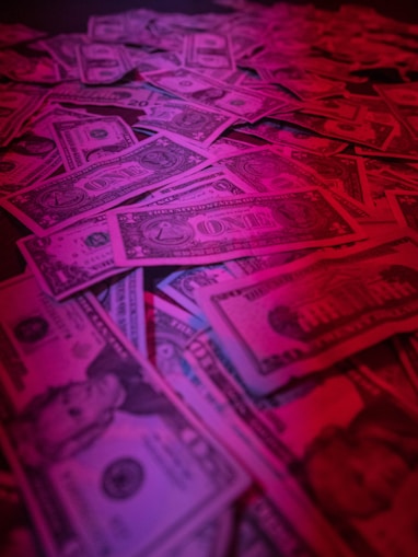 a pile of money sitting on top of a table