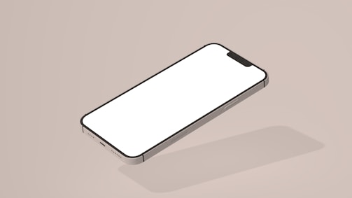 A minimalist presentation of a smartphone with a blank screen, depicted on a plain beige background. The phone is shown in an isometric view, highlighting its sleek design and shadow.