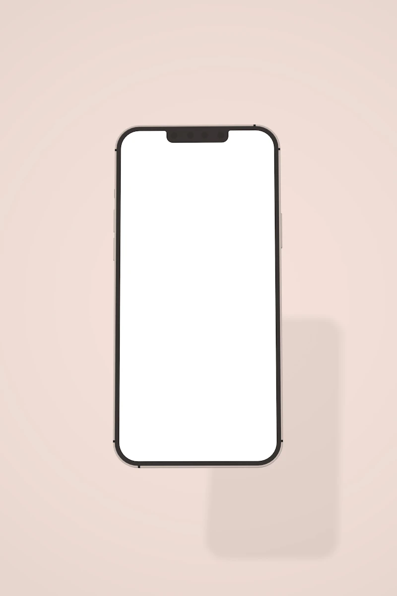 White phone on a pink background