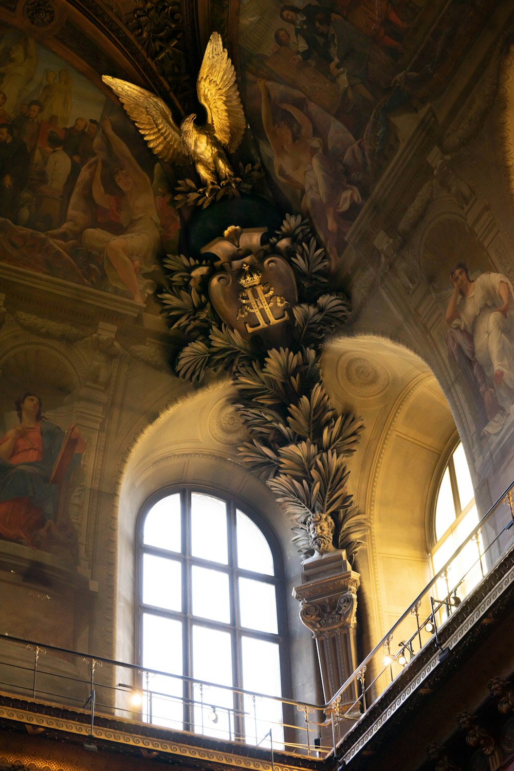 an ornate ceiling in a building with paintings on it