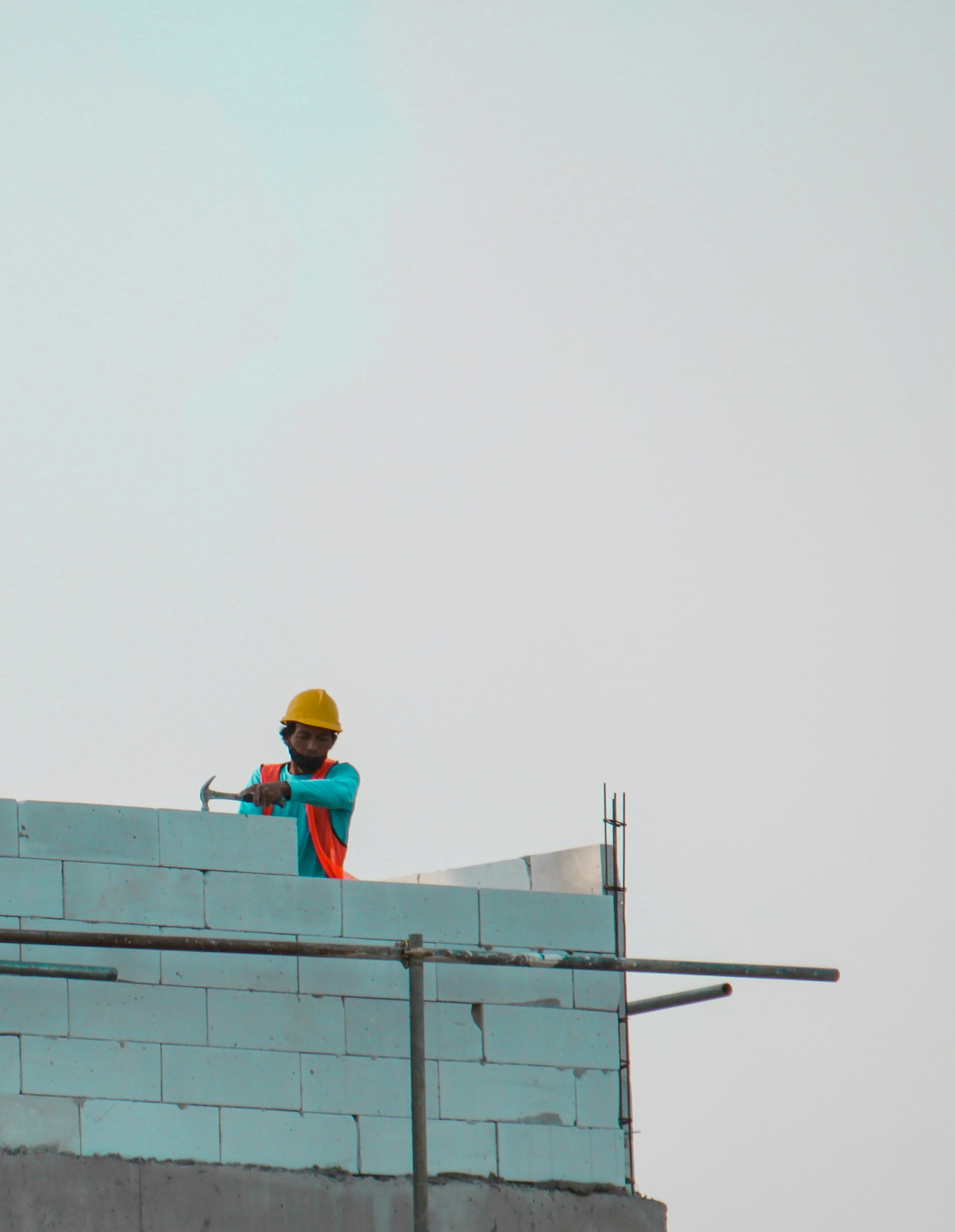 a construction worker on top of a building
