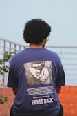 a man wearing a t - shirt that says fight back
