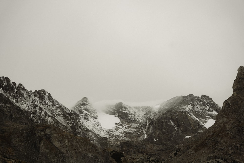 a person standing in the middle of a mountain