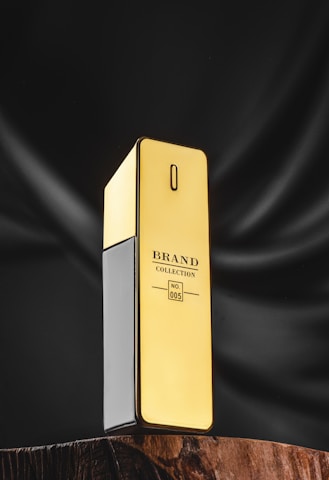 a gold cell phone sitting on top of a wooden table