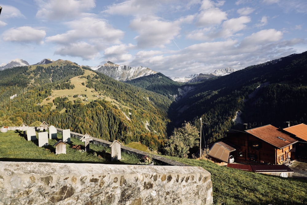 a view of a mountain range with a church in the foreground