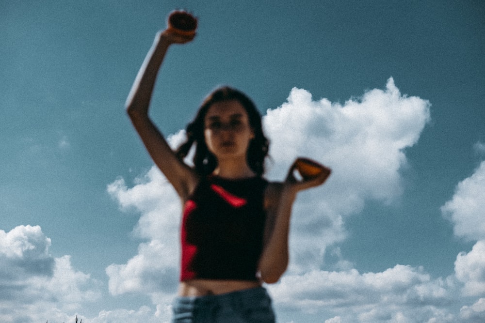 a woman holding a baseball in her right hand