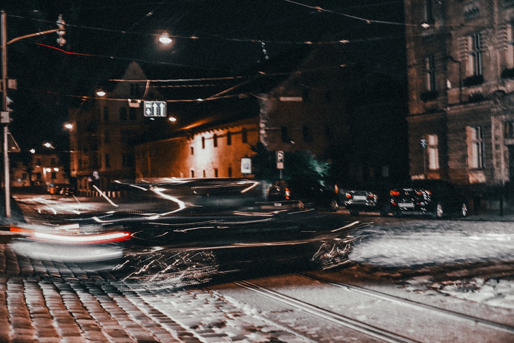 a blurry photo of a city street at night