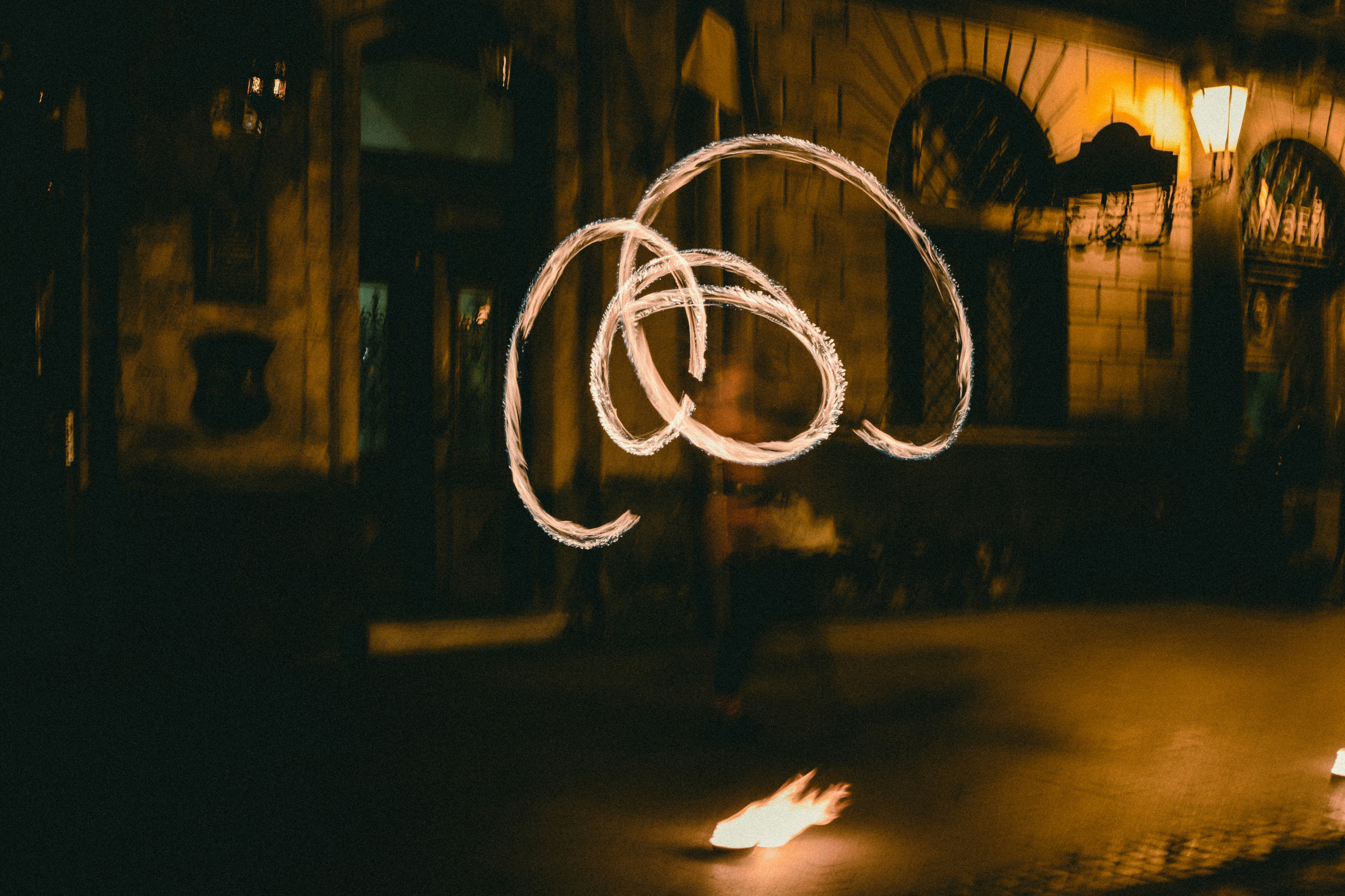 a blurry photo of a person walking down a street