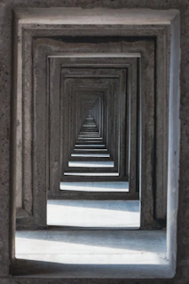 a long row of wooden frames in a room