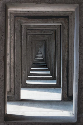 a long row of wooden frames in a room
