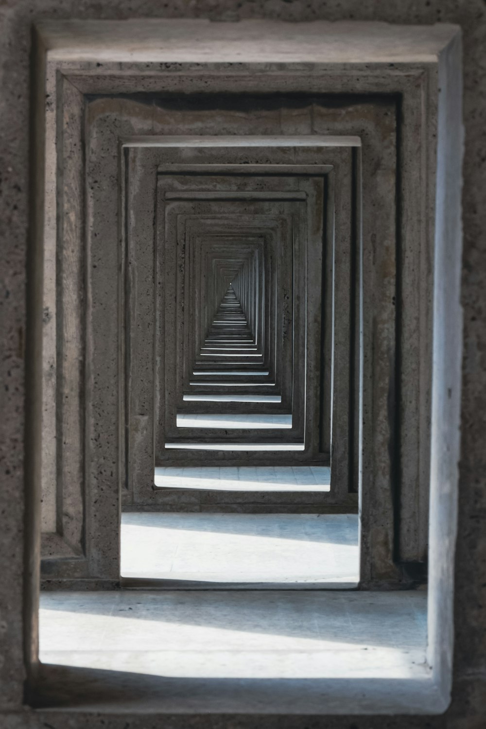 a long row of wooden frames in a room